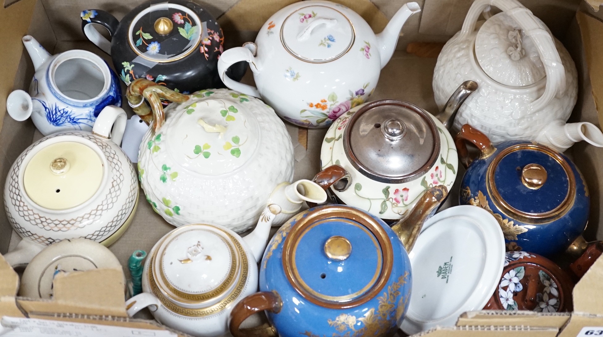 A quantity of various teapots including Belleek, Japanese Satsuma etc.